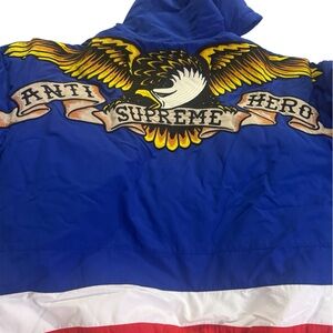 Supreme Blue Hooded Puffer Jacket with Red Logo Label